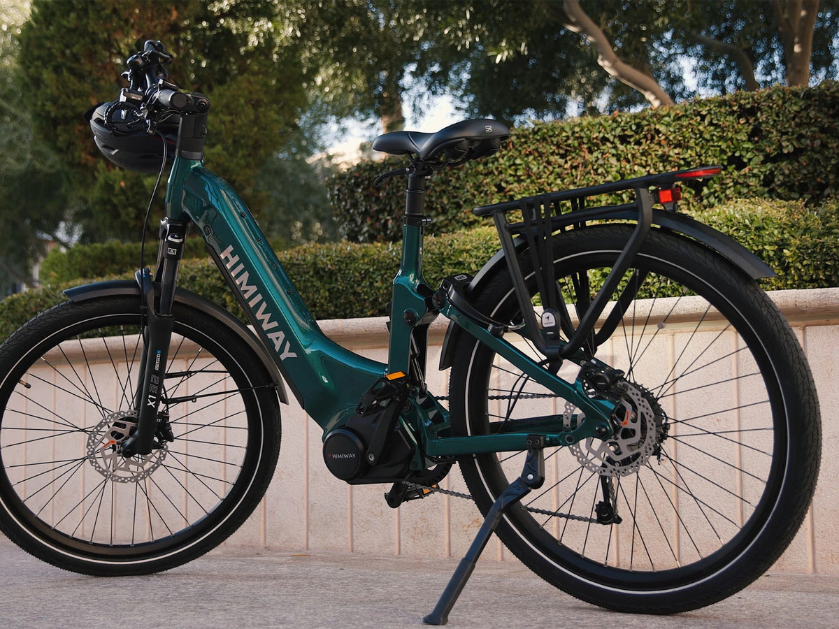 Teal electric bike with 'Himawari' branding parked on a sidewalk.